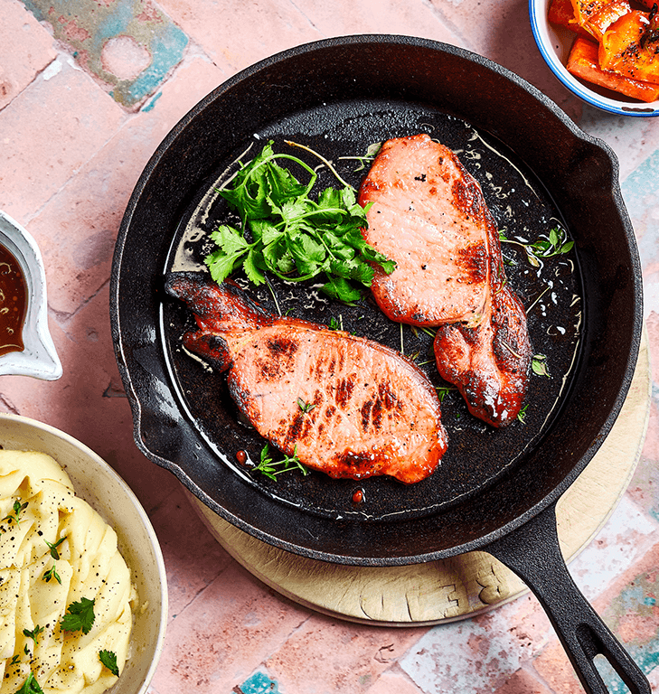 Delicious Naked bacon in a frying pan, produced by Finnebrogue.